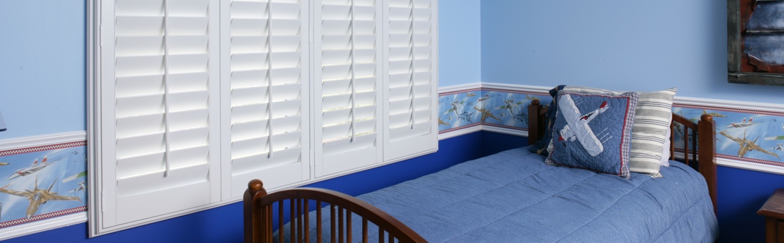 Blue boys bedroom with shutters
